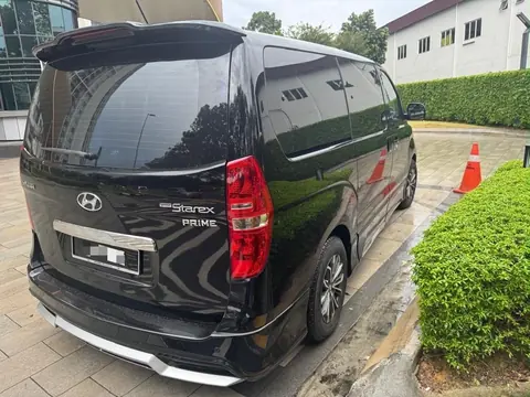 Rear of the Hyundai Grand Starex Plus from the right